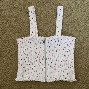 white and red flowered crop top with fully functional zipper in the front